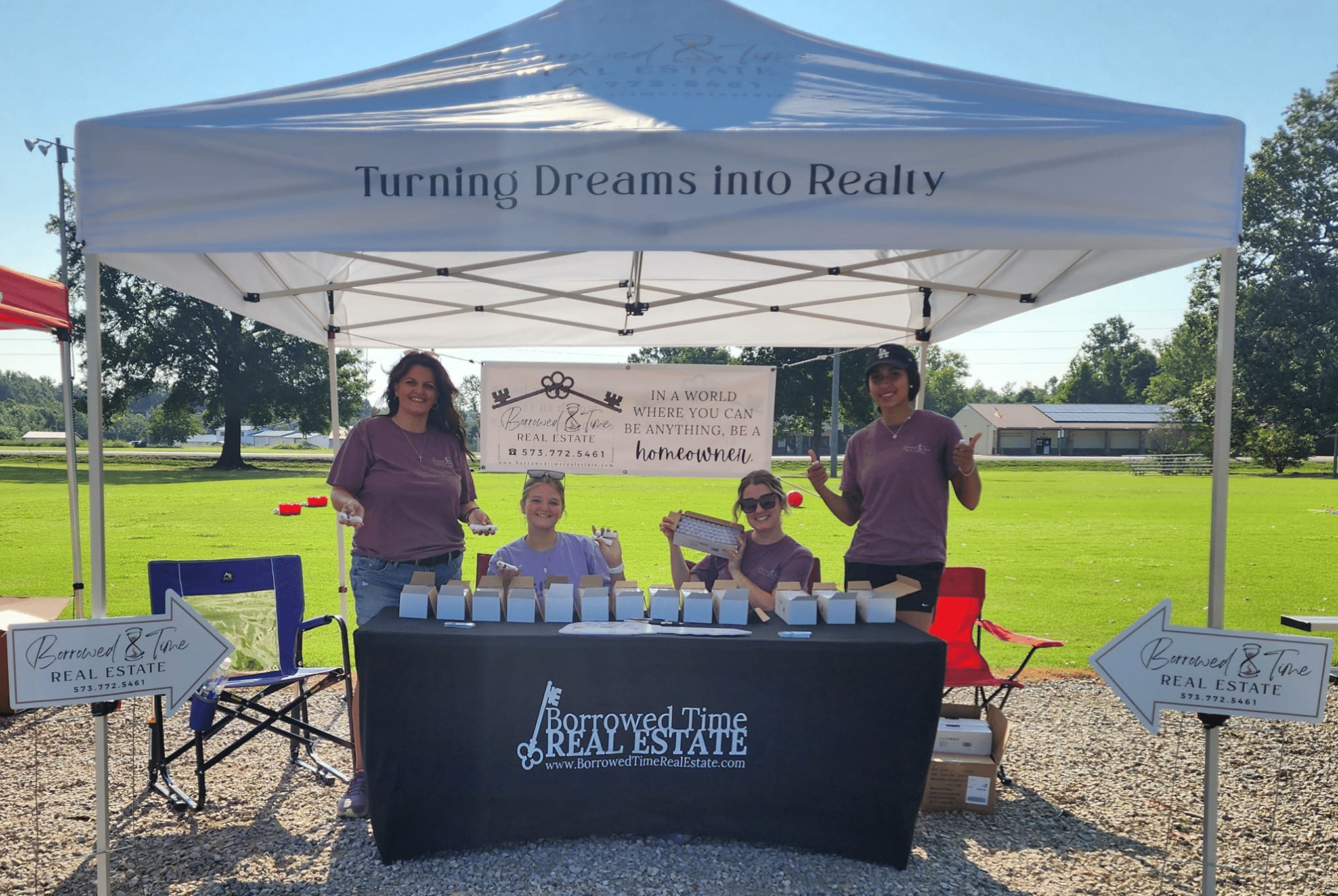 Borrowed Time Real Estate passing out school supplies at the Poplar Bluff Back to School Bash.