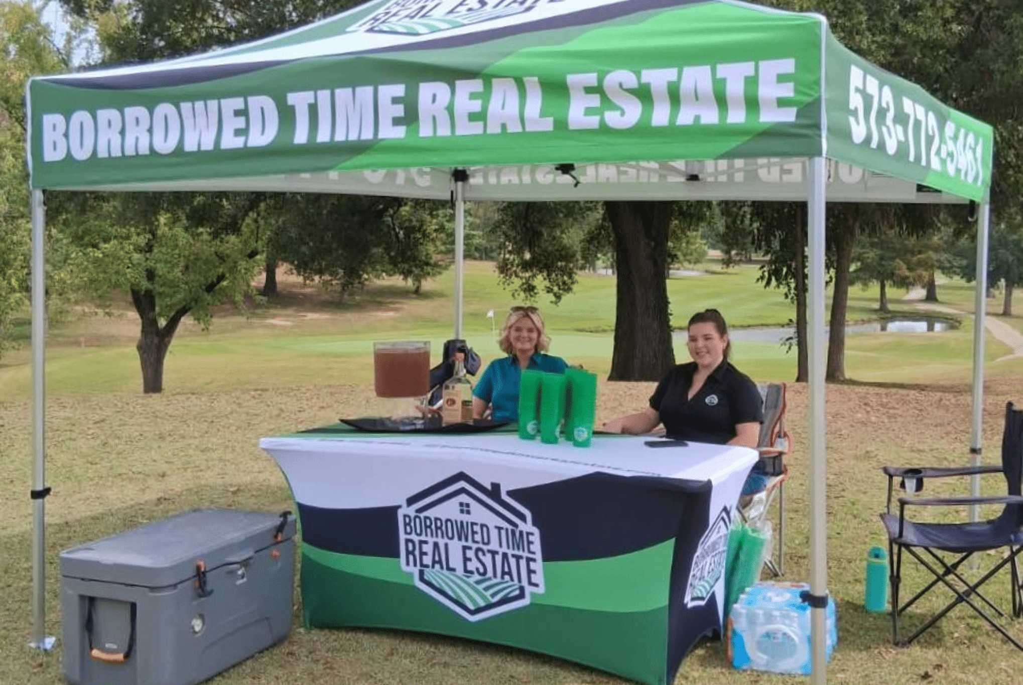Borrowed Time Real Estate serving drinks and supporting FosterAdopt Connect at Ozark Ridge Golf Course.