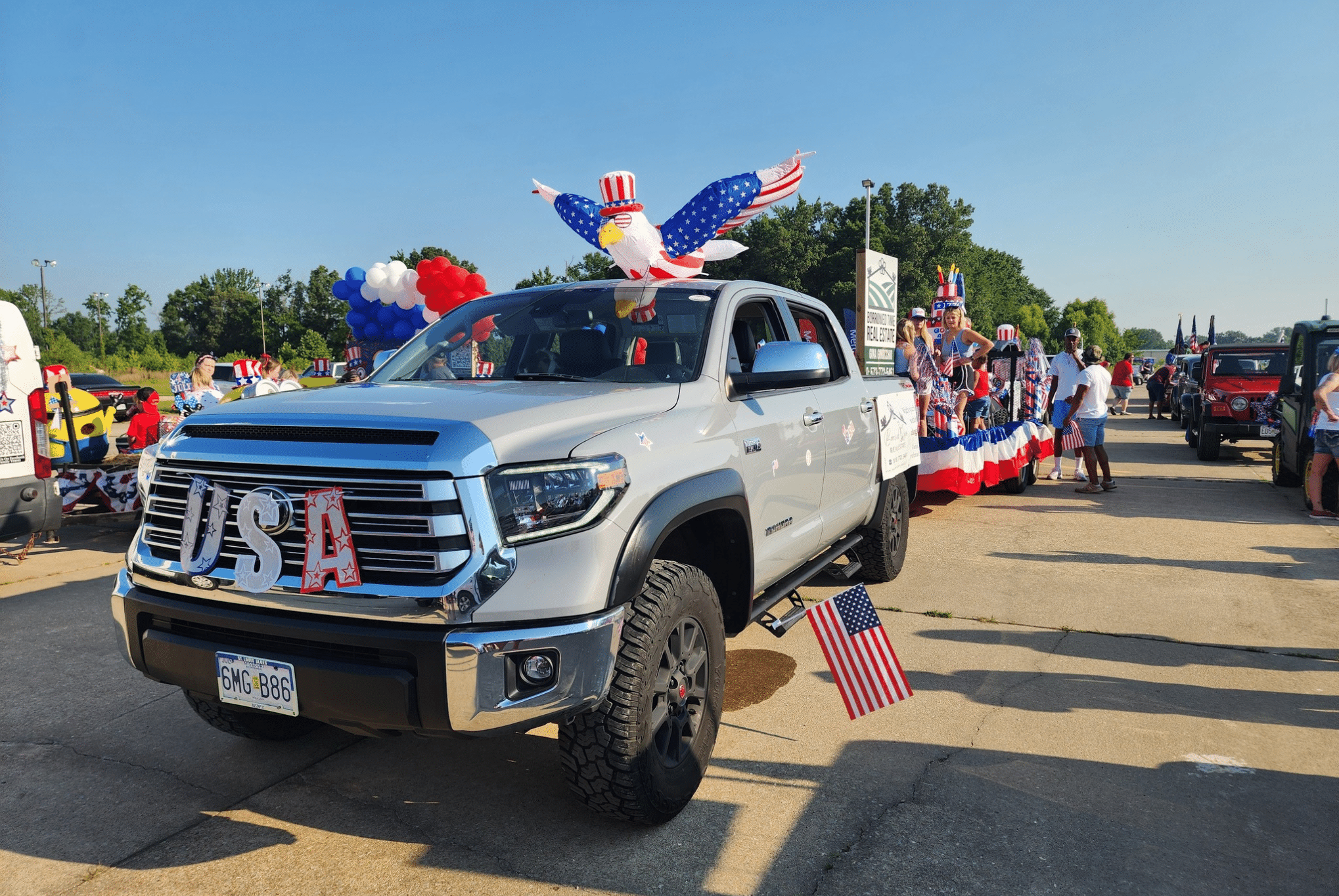 Borrowed Time Real Estate celebrating Independence Day during the Daily American Republic parade in Poplar Bluff.