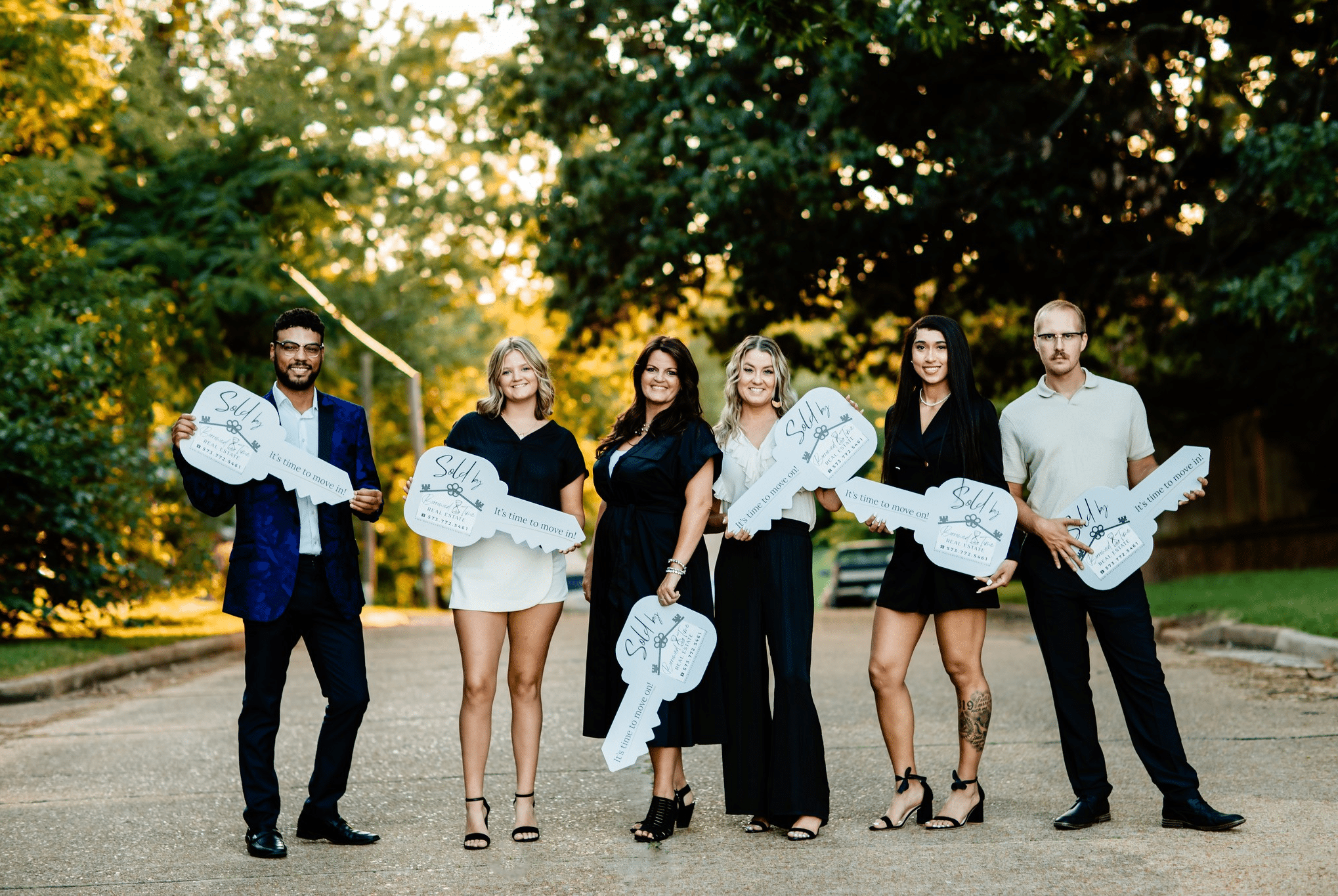 Borrowed Time Real Estate team photo from a July branding session in Poplar Bluff.