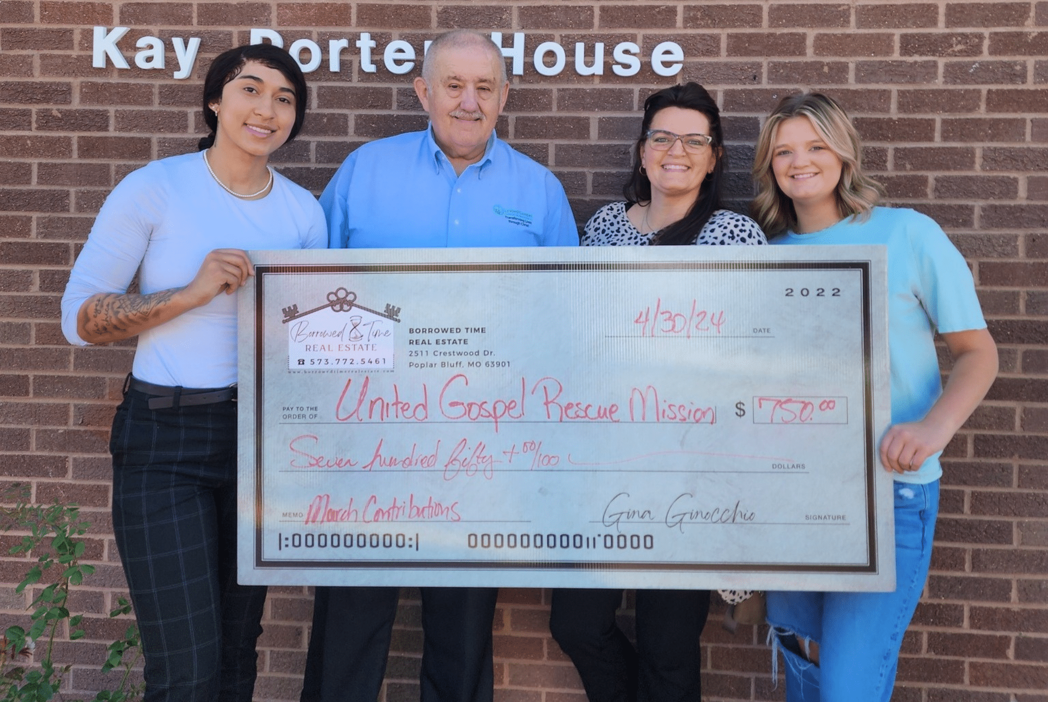 Borrowed Time Real Estate presents a community donation check to the United Gospel Rescue Mission in Poplar Bluff.