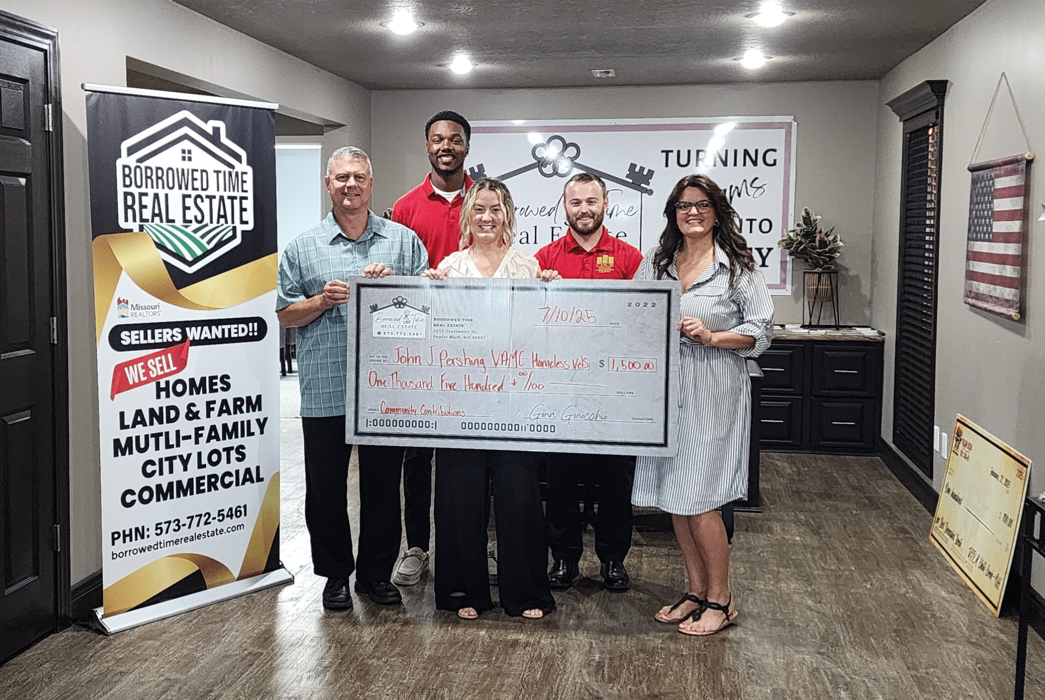 Borrowed Time Real Estate presents a donation check to the John J. Pershing VA Medical Center supporting veteran housing efforts in Poplar Bluff, Missouri.