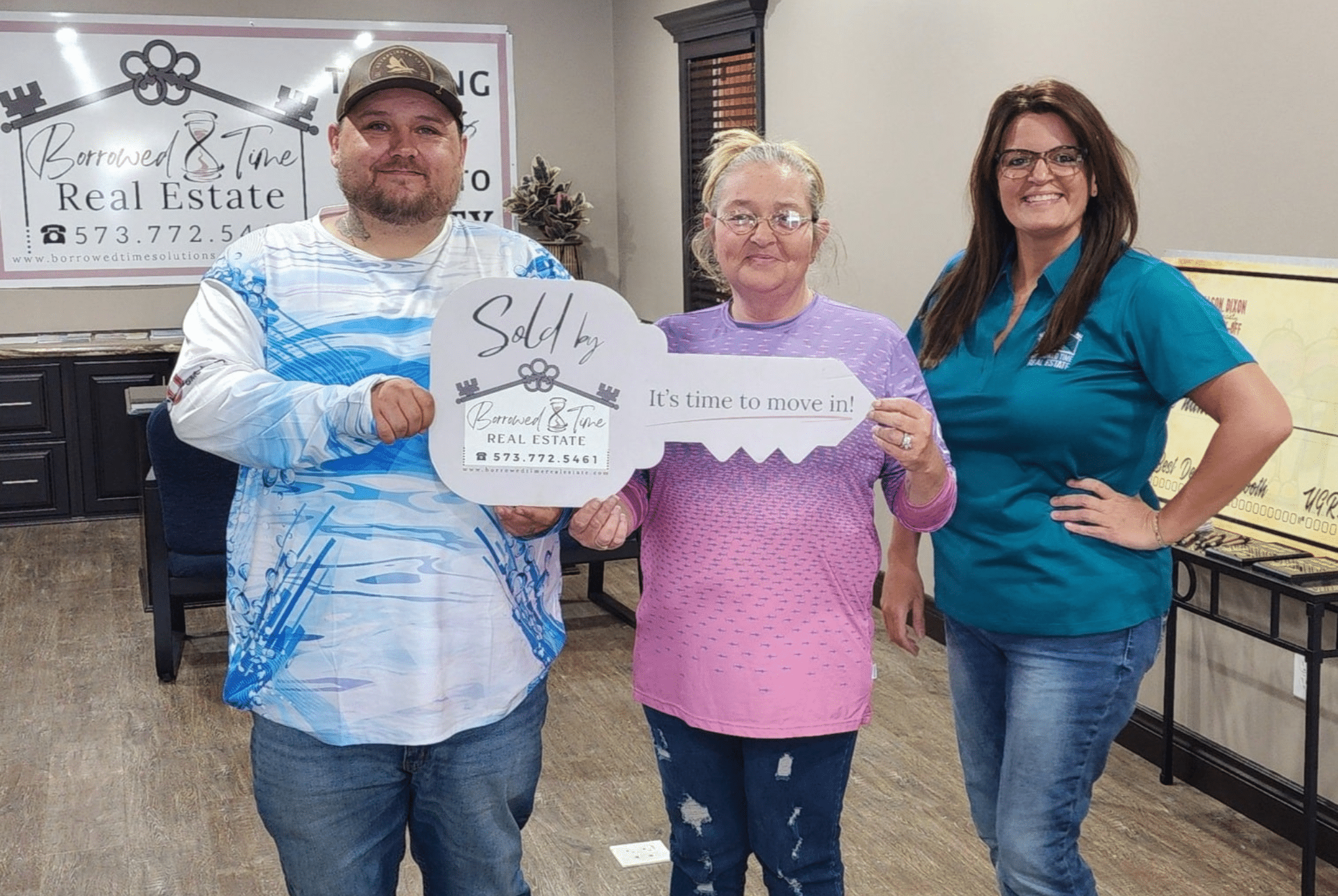 Homebuyers celebrating USDA loan closing day with Borrowed Time Real Estate