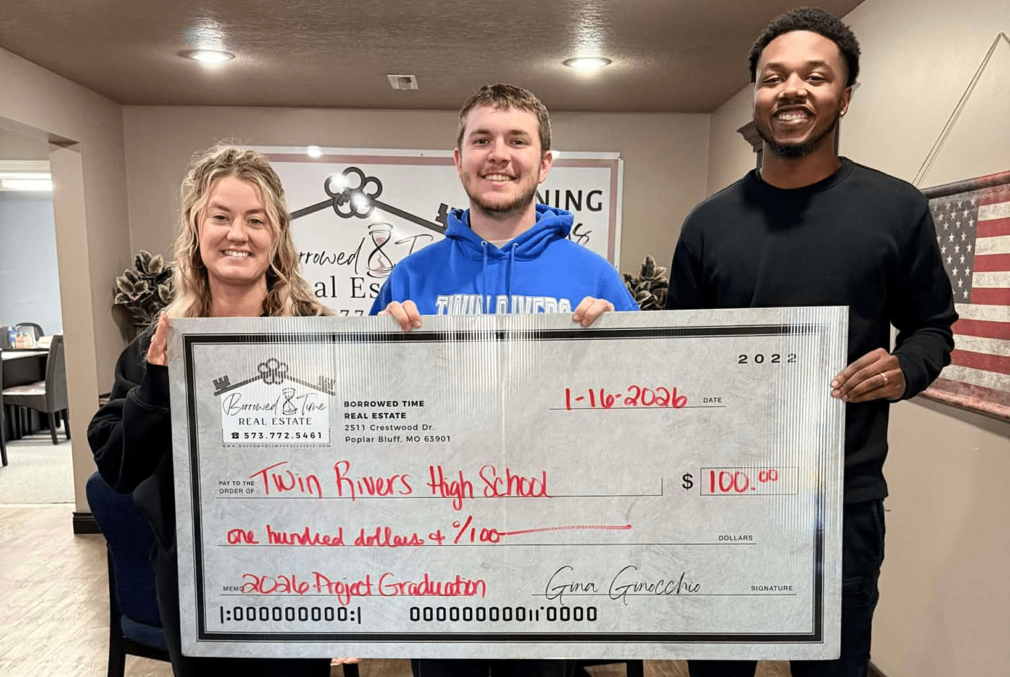 Borrowed Time Real Estate presents a donation check to support Twin Rivers Class of 2026 Project Graduation in Poplar Bluff, Missouri.