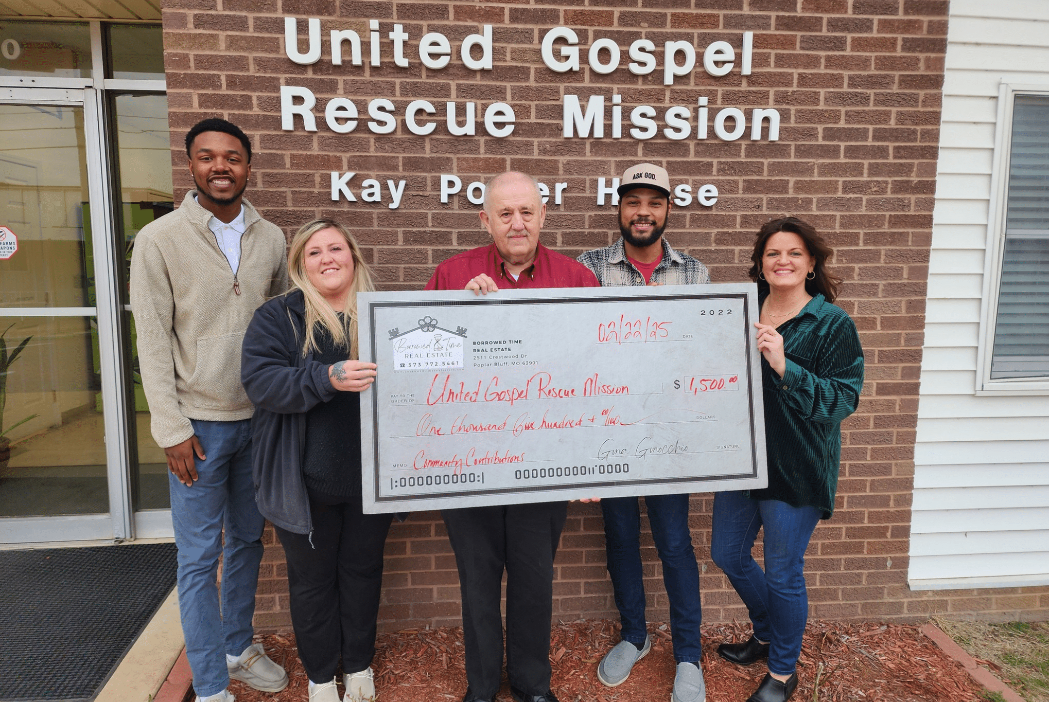 Borrowed Time Real Estate presents a donation check to the United Gospel Rescue Mission in Poplar Bluff, Missouri, supporting local outreach and shelter services.