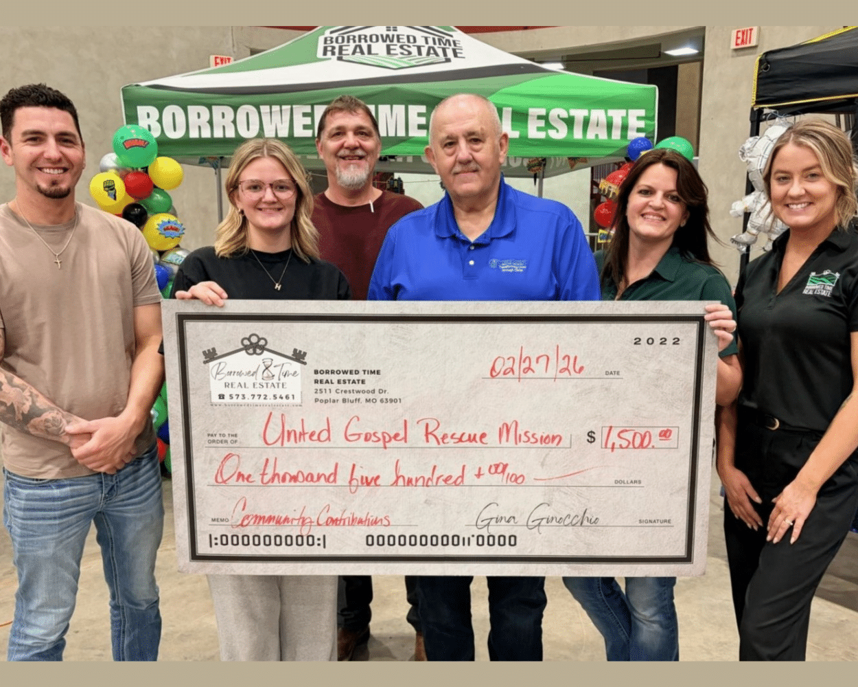Borrowed Time Real Estate team presenting a $1500 donation check to the United Gospel Rescue Mission in Poplar Bluff Missouri during a local community fundraising event