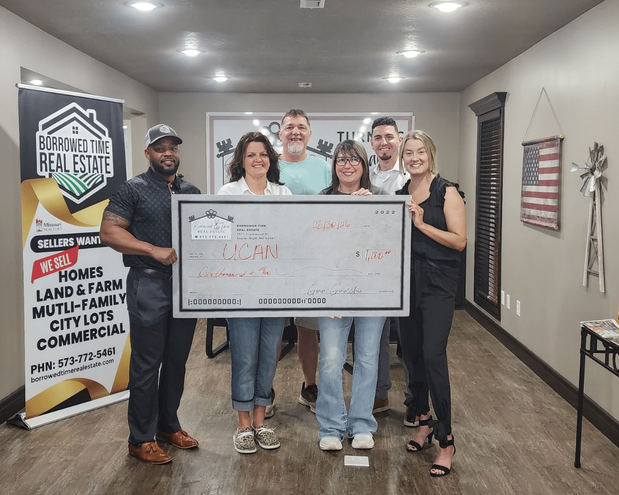 Borrowed Time Real Estate team presenting donation check to UCAN in Poplar Bluff Missouri to support local cancer patients